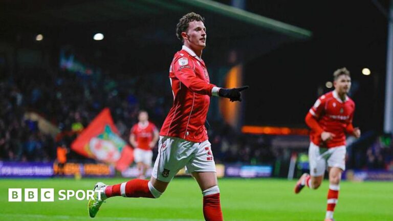 Wrexham forward Nathan Broadhead celebrates