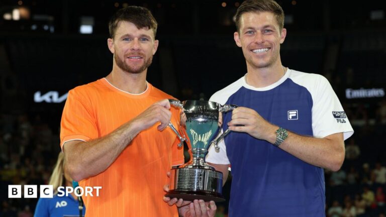 Australian Open 2026: GB’s Neal Skupski and Christian Harrison win men’s doubles title Christian Harrison and Neal Skupski hold the Australian Open men's doubles trophy