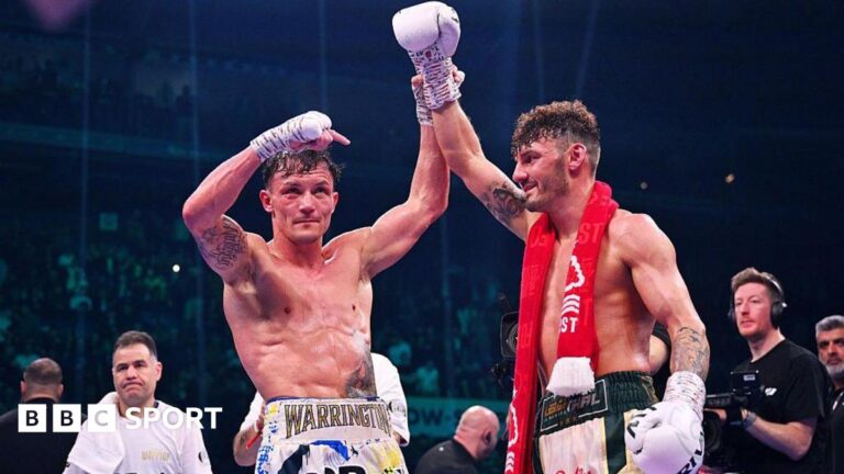 Josh Warrington holds up Leigh Wood's hand