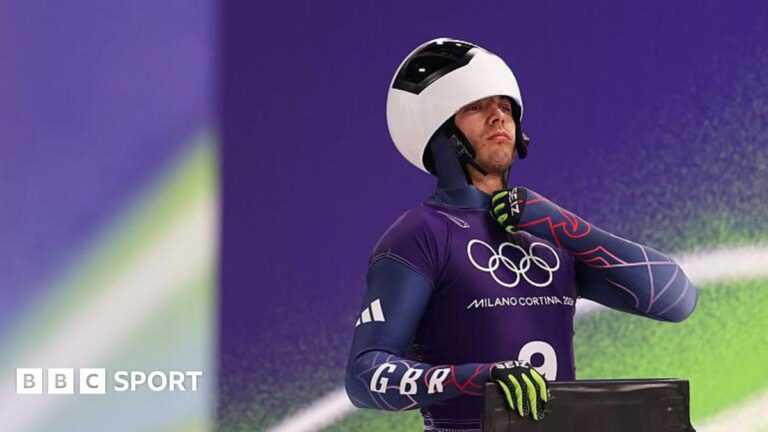 Matt Weston does up his race suit