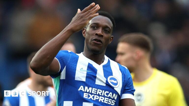 Brighton striker Danny Welbeck waves to fans after victory over Nottingham Forest
