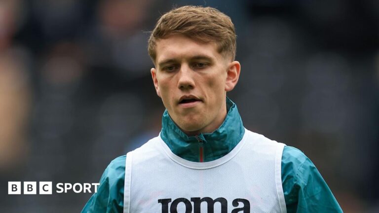 Ethan Galbraith warms up before a Swansea game