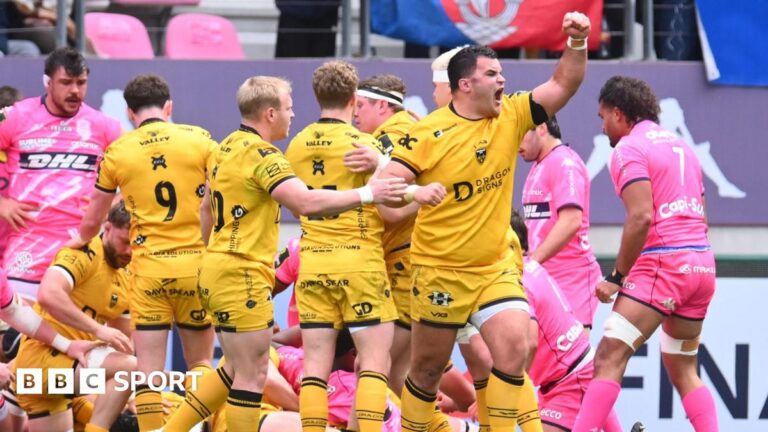 Dragons prop Chris Coleman celebrates a try