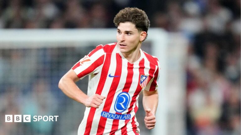 Julian Alvarez running in Atletico Madrid's red and white striped home shirt