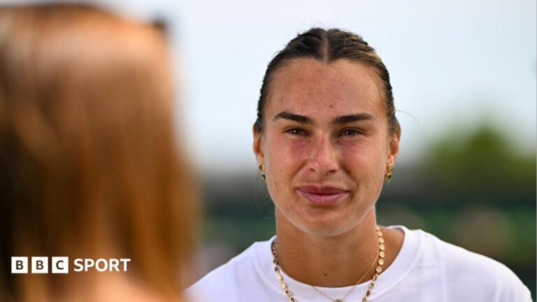 Aryna Sabalenka talks to the media
