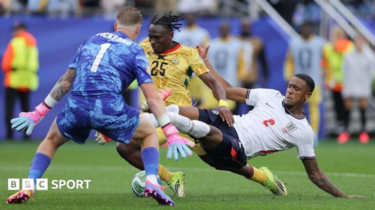 Ezri Konsa of England makes a last-ditch challenge on Ghana's Prince Kwabena Adu