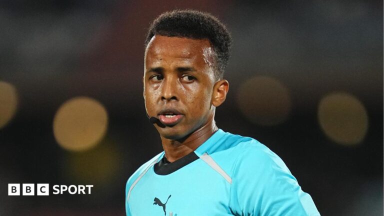 Omar Artan refereeing a match