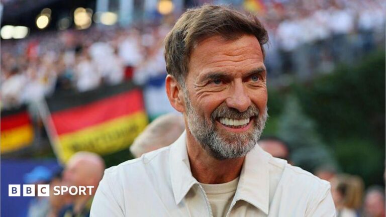 Jurgen Klopp smiles while on the sideline for Germany's World Cup game against Paraguay in June 2026