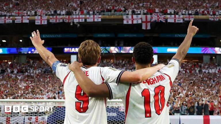 Jude Bellingham and Harry Kane of England salute the fans after the 2-1 victory over Norway