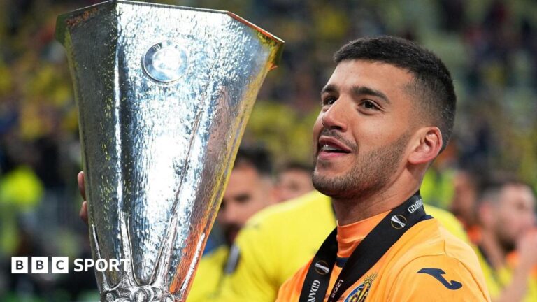 Geronimo Rulli holds the Europa League trophy