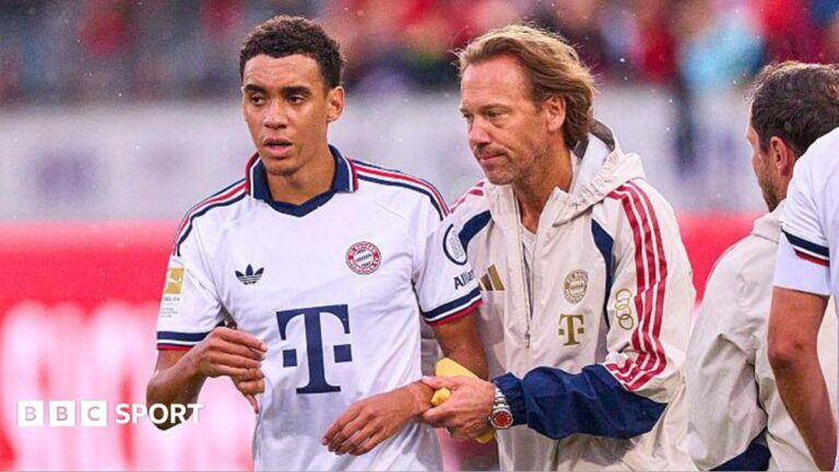 Jamal Musiala is helped off the pitch