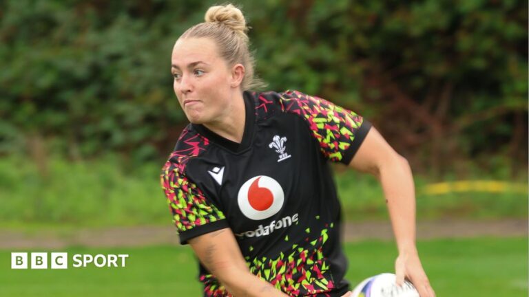 Megan Davey passes the ball in Wales training