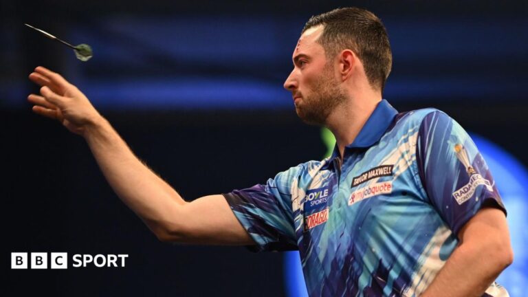 Luke Humphries throws a dart during his match against Niels Zonneveld at the World Grand Prix
